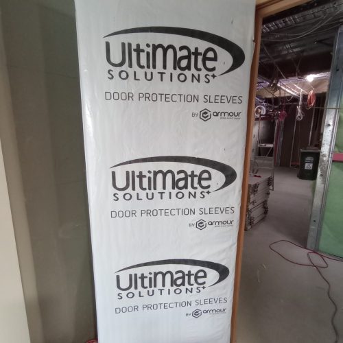Ultimate Door Protection Sleeve, a reusable cover designed to protect doors from damage during construction and renovation.